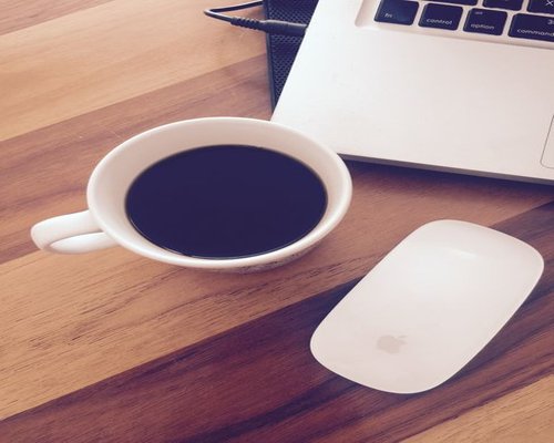A cup of coffee on a desk in Costa Rica